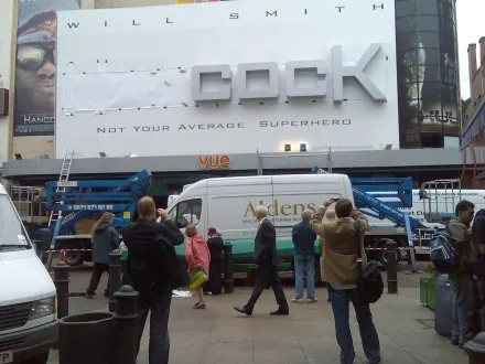 A Will Smith billboard in London with the start of “Hancock” covered up, leaving “COCK” above “Not your average superhero”