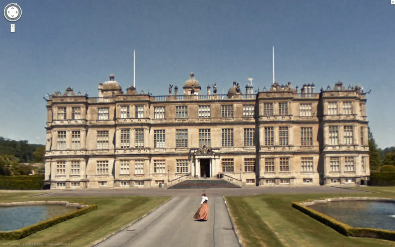 Google Street View of Longleat House, with a woman in Victorian dress walking up the drive
