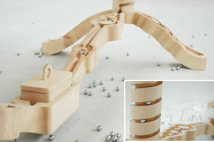 The hand carved Marbelous table has spiraled supports and a simple maze carved into the legs. There…